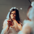 Bride crying while holding a phone