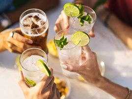 Group of people celebrating toasting with cocktails