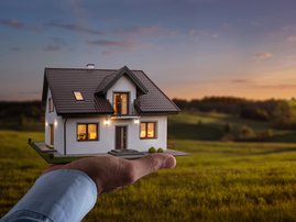 Male hand showing offering a new dream house